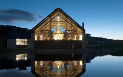 back view of dalmunach distillery building exterior at night