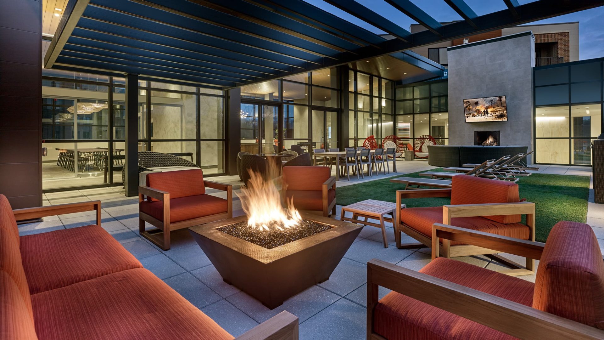 patio fire pit with chairs in keva flats apartments building