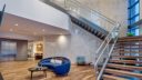 couch and staircase in keva flats apartments building