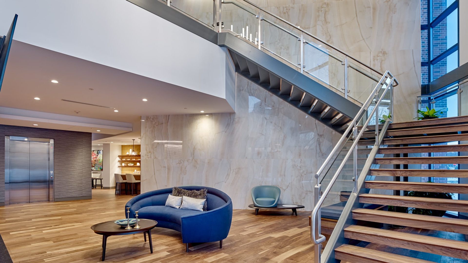 couch and staircase in keva flats apartments building