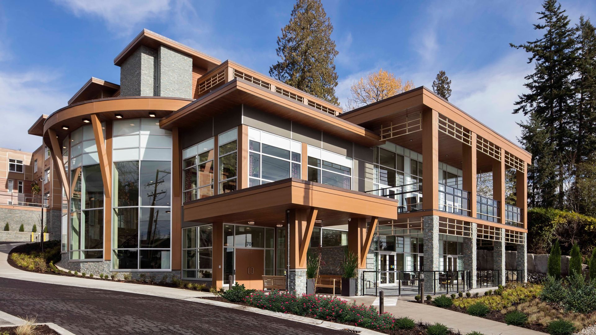building exterior with driveway at maison senior living