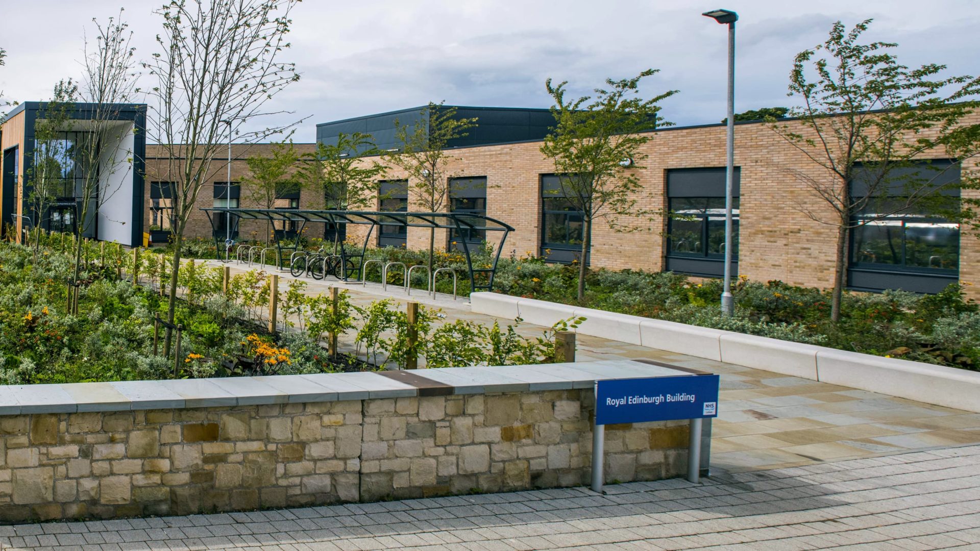 building exterior with plants and trees at royal edinburgh hospital