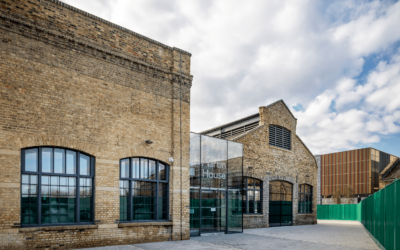 brick building exterior with green fence at Sand Martin House