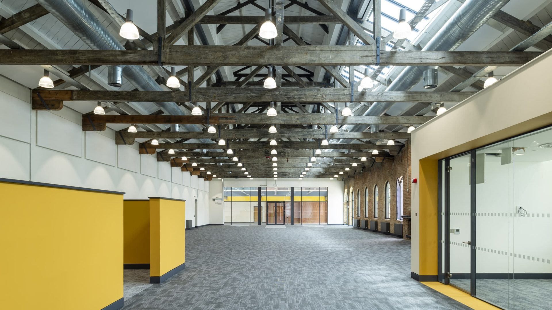 yellow walls and building interior of Sand Martin House