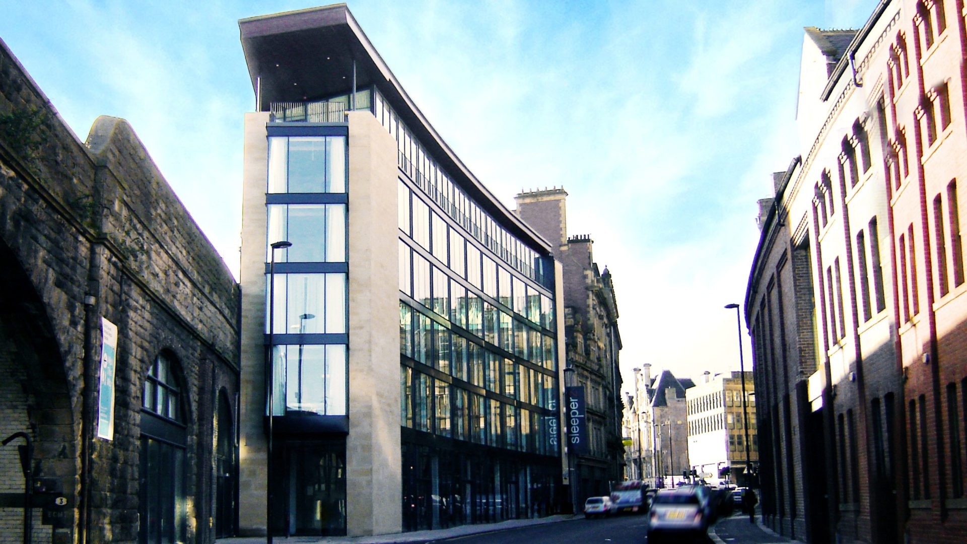 daytime exterior image of hospitality building sleeperz hotel