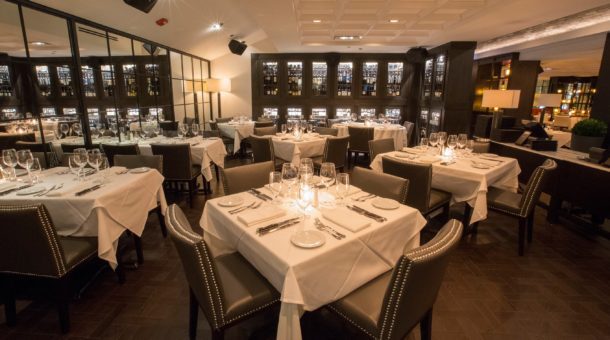 interior with tables and chairs at steak 48 restaurant