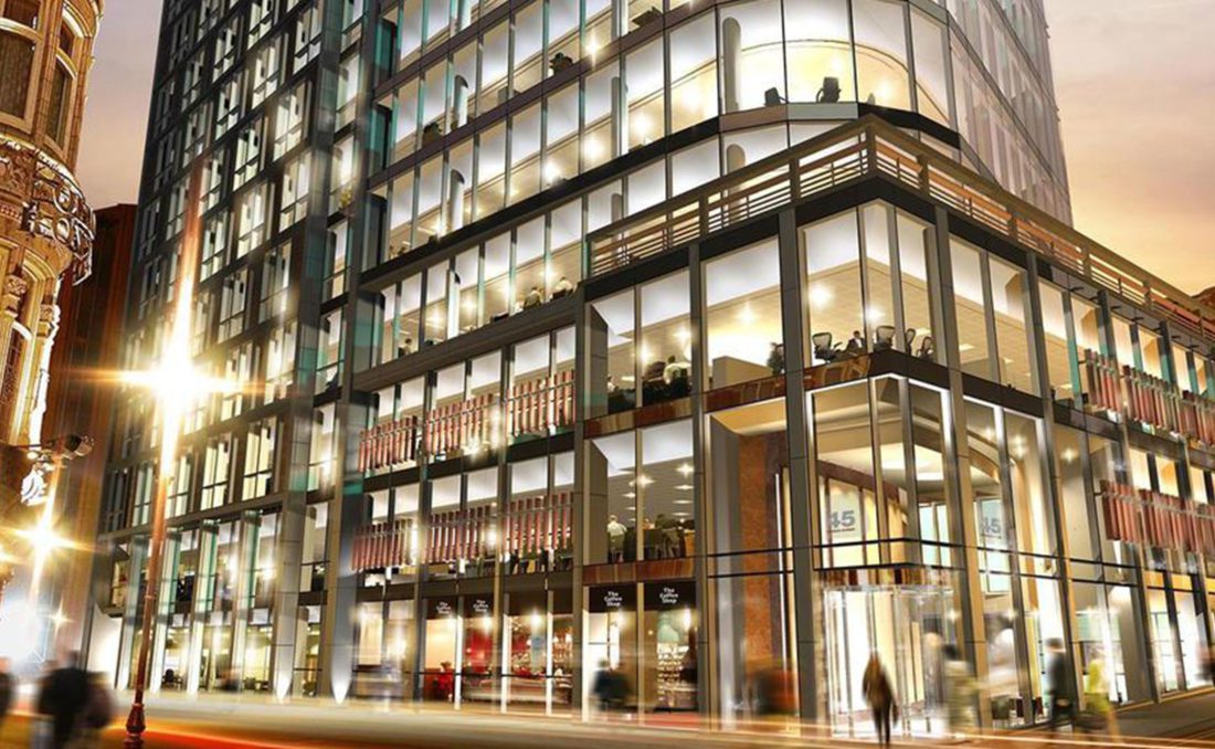 building exterior of a glass building at night