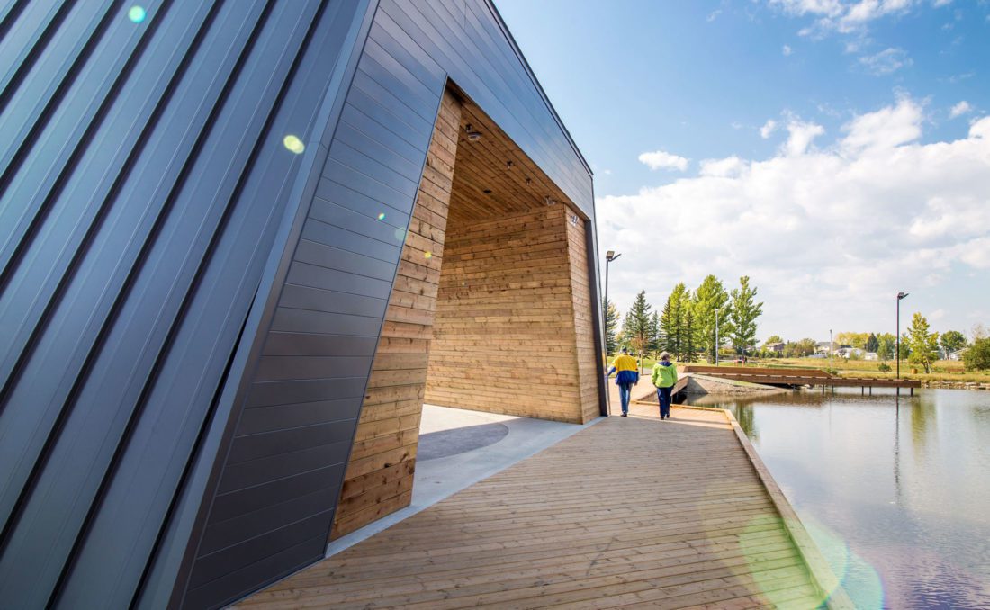 modern building next to a pond
