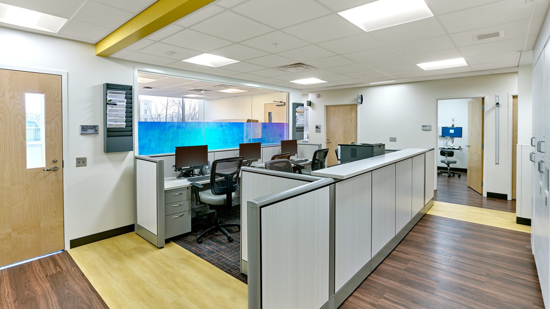 Roseville Staff Desks and Cubicles. bright with yellow and light wood accents
