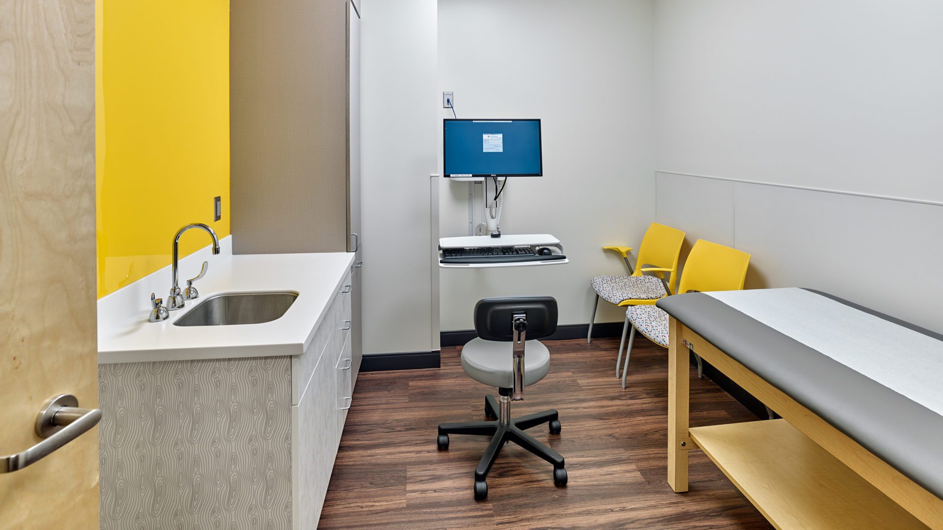 view of Roseville Examination Room. bright room with yellow accents