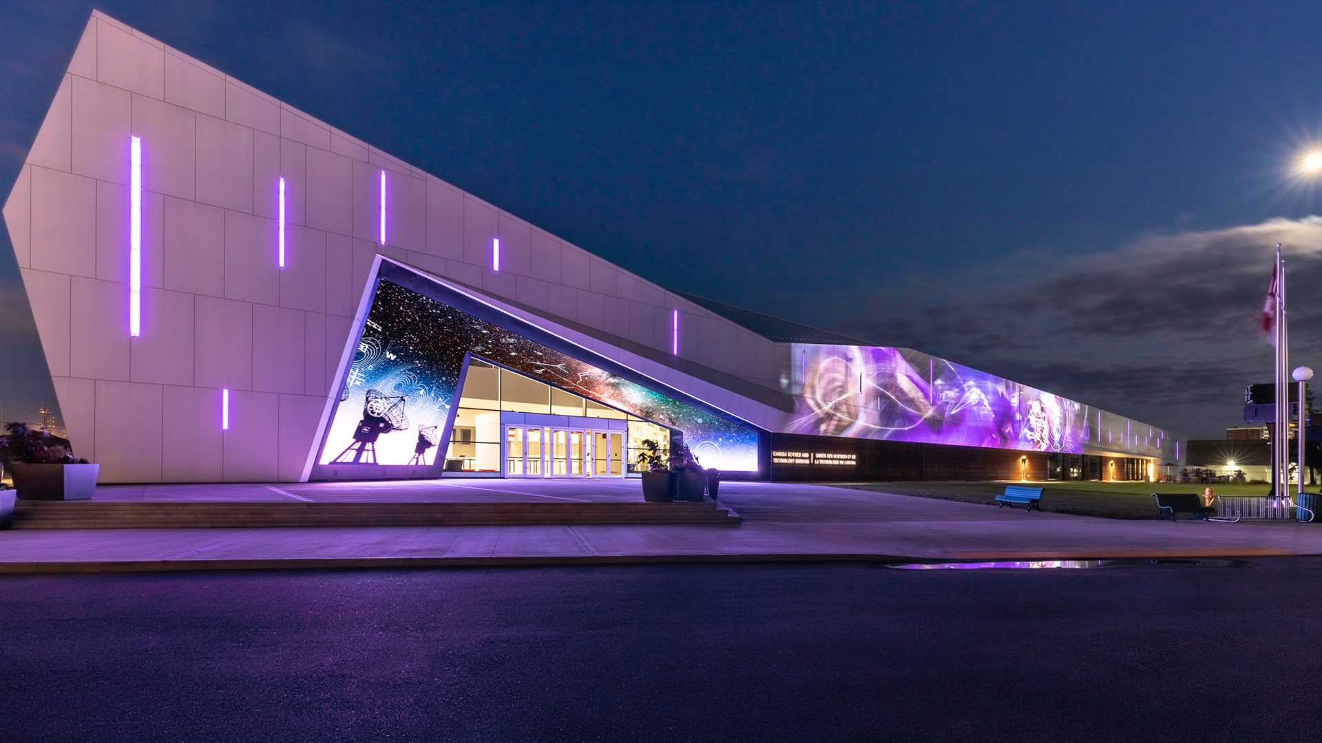 nighttime exterior image of public building canada science and technology museum in ottawa ontario