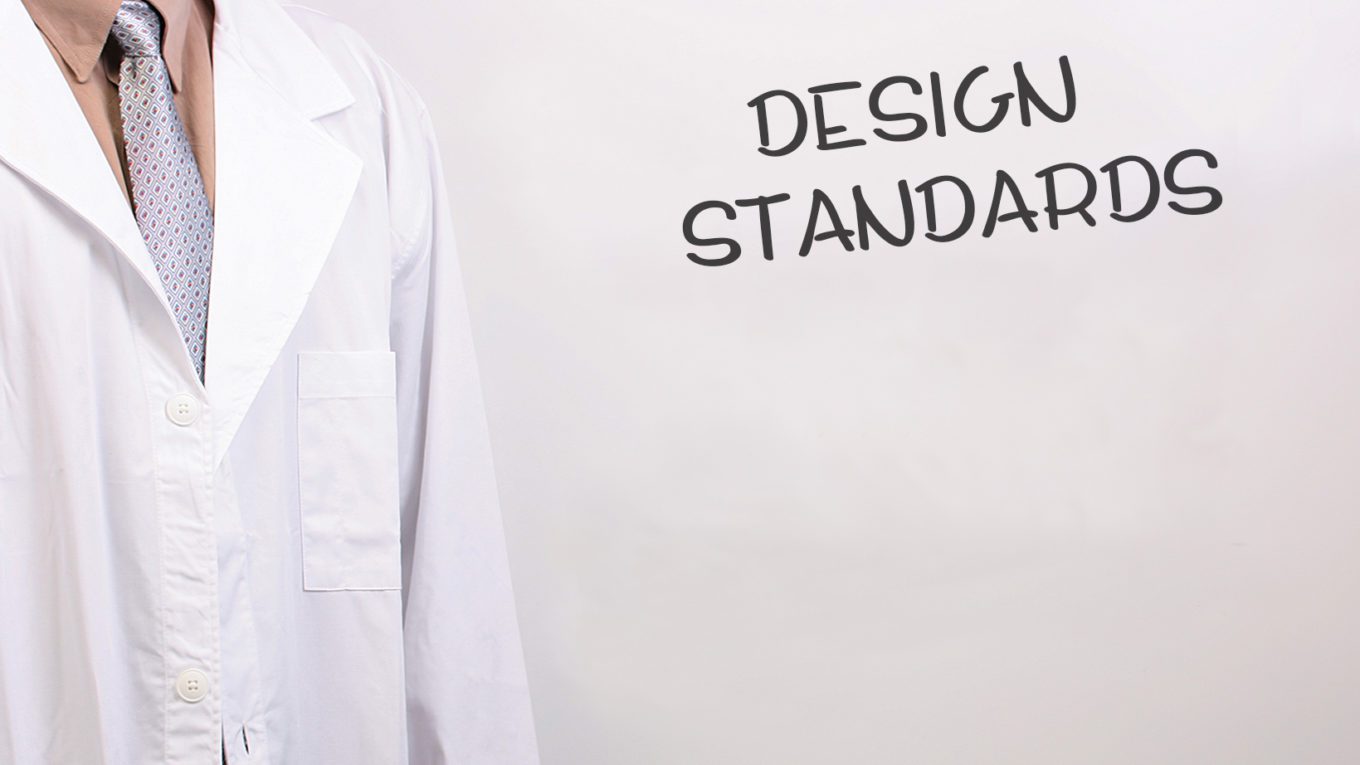 person in a tie and white coat beside design standards text