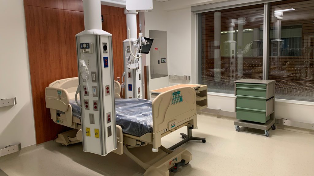 empty medical bed in a hospital room