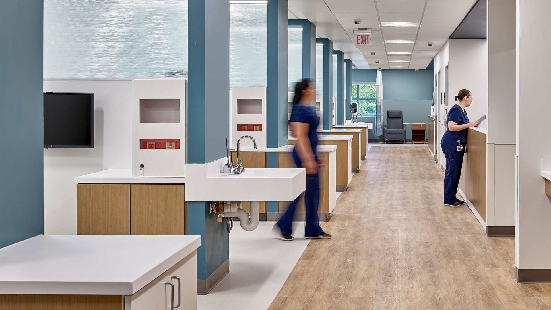 health care center hallway with sinces and medical equipment