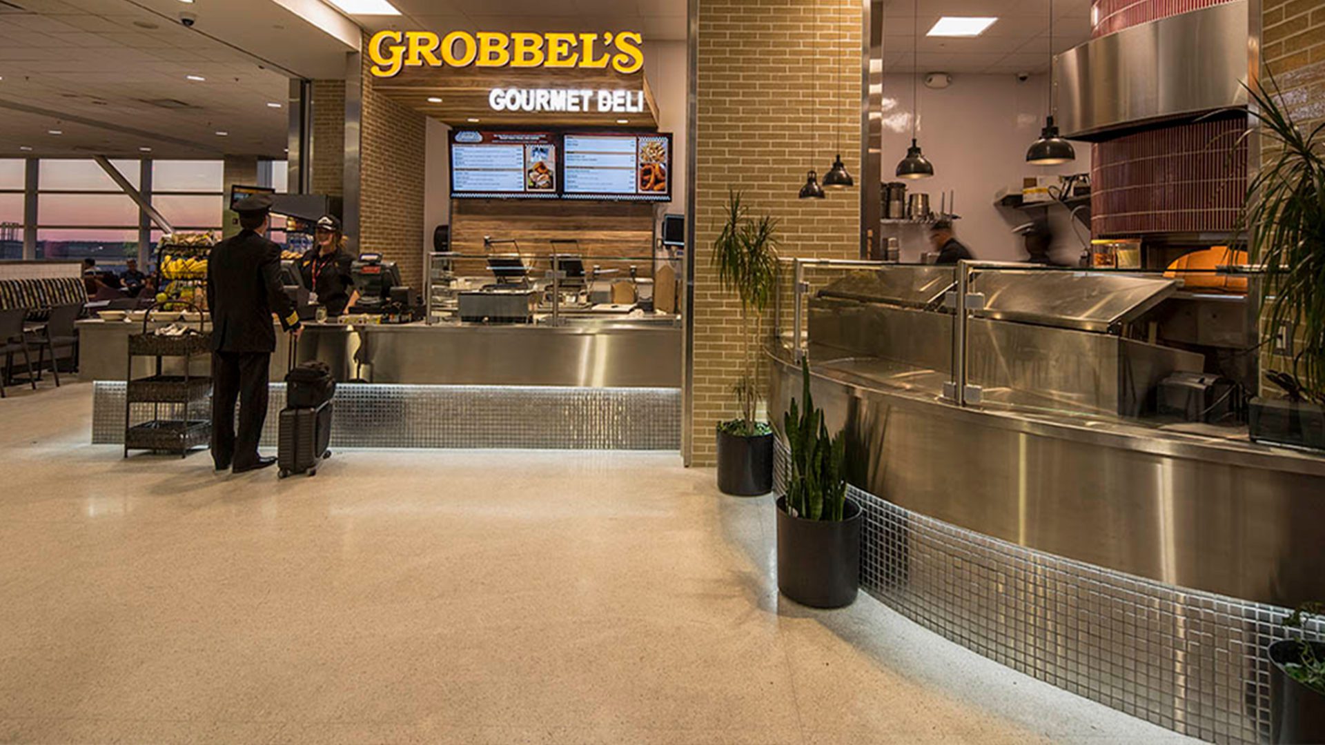 view of deli counter at Eastern Market @ DTW. sign reads "grobbel's gourmet deli"