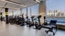 bicycle machines with view of city at 10XTO Athletic Club Gym