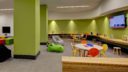 whimsical and colorful assortment of furniture in 10XTO Athletic Club Play Room