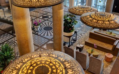 high view of hotel x lobby. large and decorated entrance with tiled floors