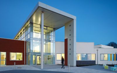 ground floor exterior view of Midpark Hospital. man walking to entrance.