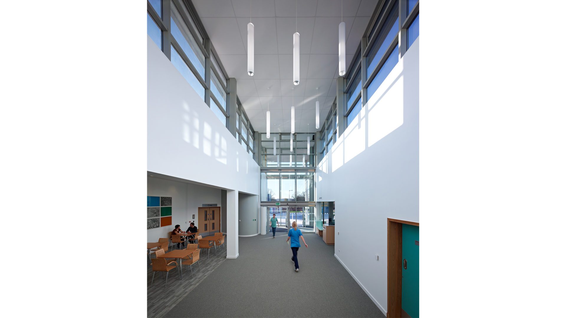 Midpark Hospital Interior. tall ceilings and white walls. busy sitting area.