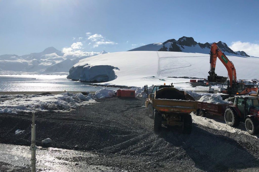 Excavators clear the snow at the site of Rothera Research Station