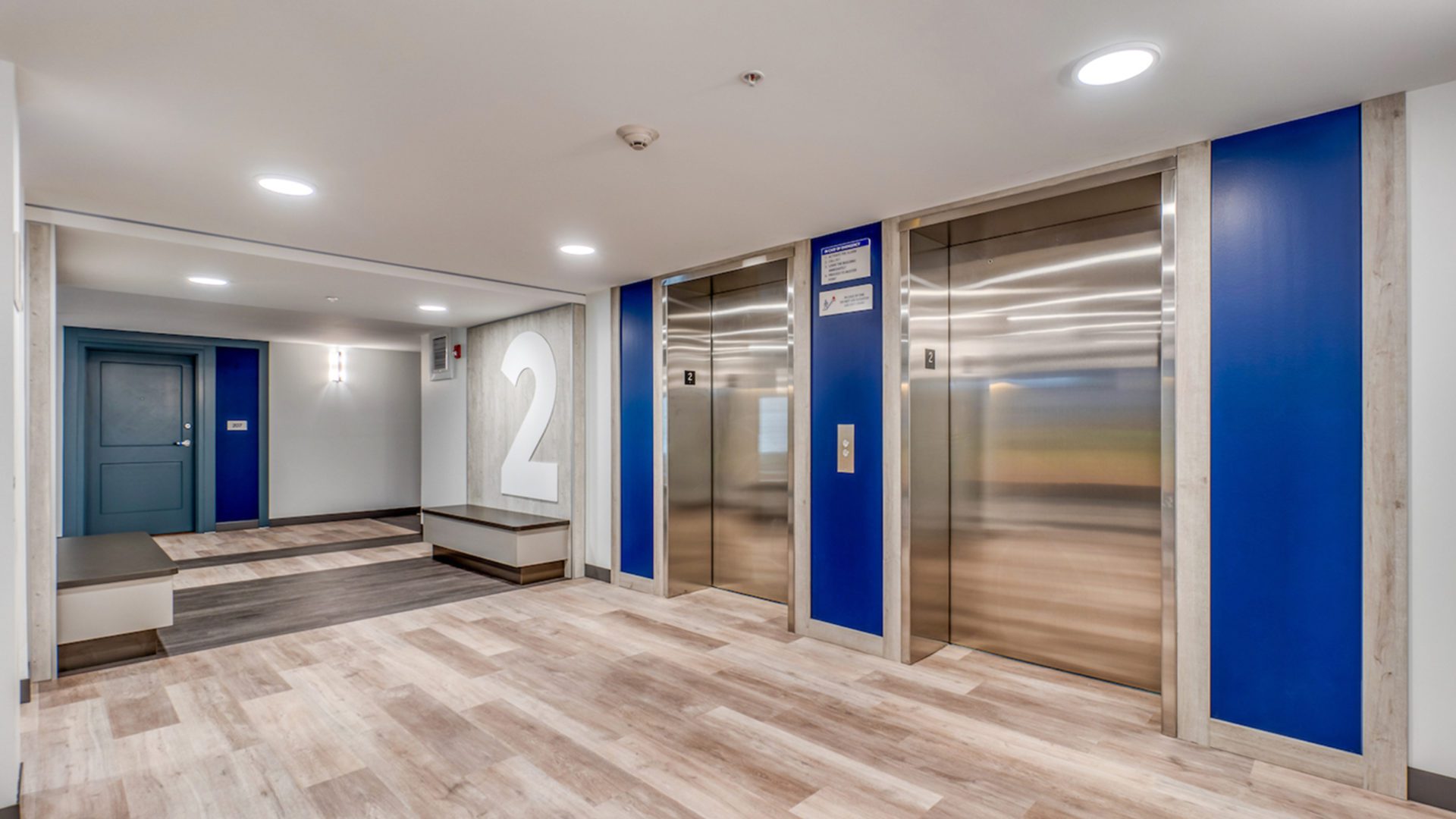 Second floor elevator waiting area at Bishop's Manor residential building