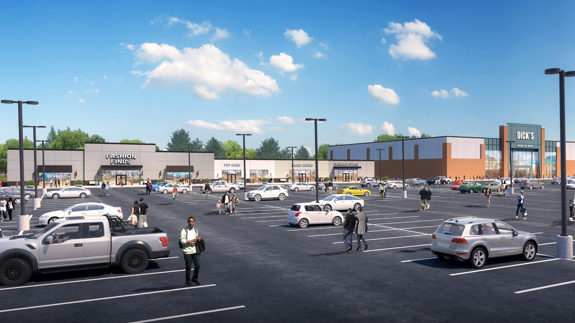 Spacious parking lot with scattered cars and people walking toward various retail stores under a partly cloudy sky.