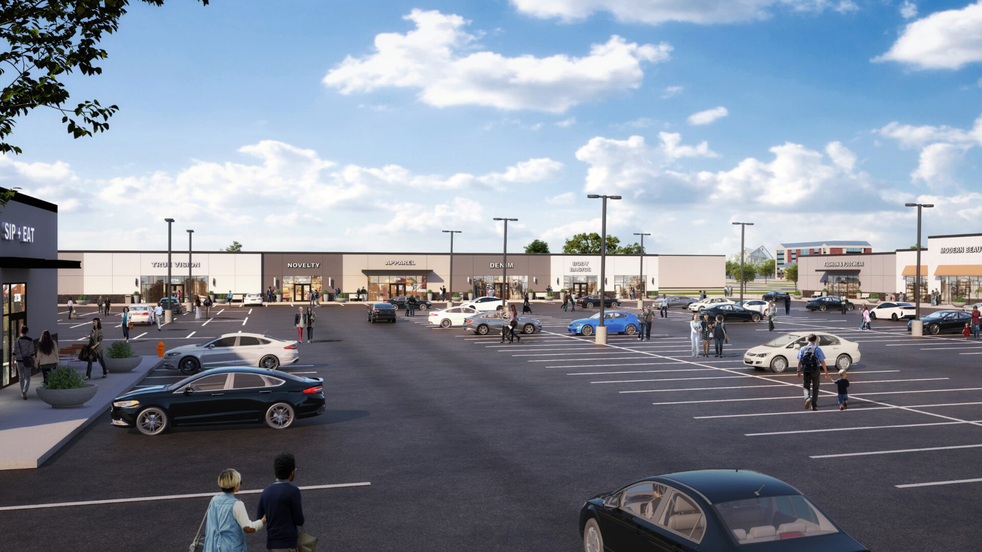Wide view of a shopping center parking lot with scattered cars and people walking towards stores under a partly cloudy sky.